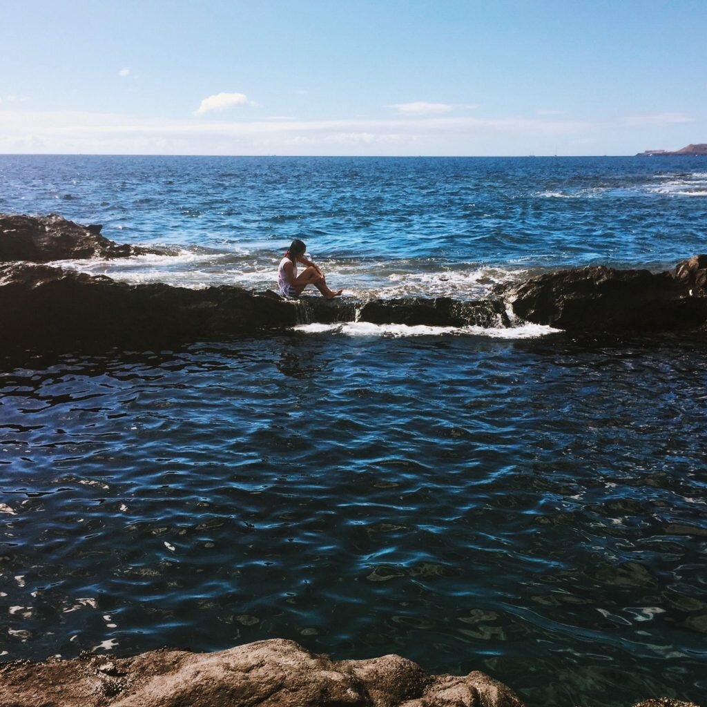 a girl in the natural pools in Tenerife
