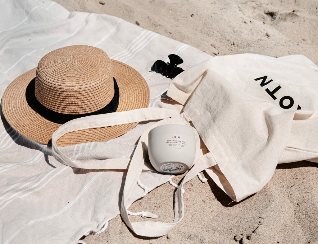 eco-friendly travel products on sand